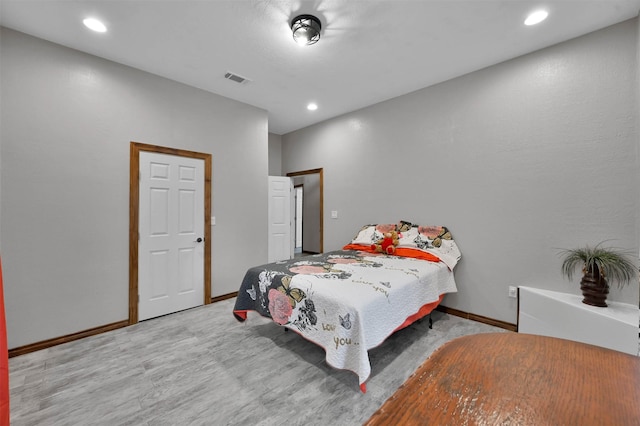 bedroom with light hardwood / wood-style floors