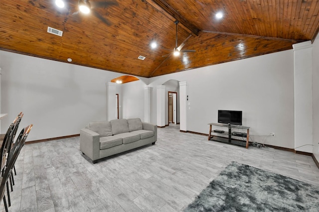 living room with beam ceiling, light wood-type flooring, decorative columns, and ceiling fan