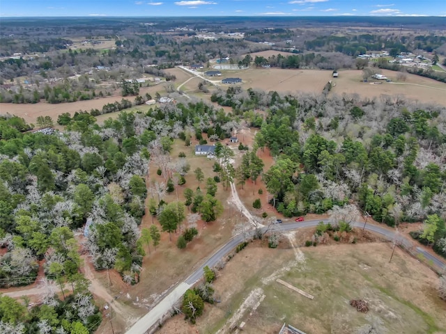 birds eye view of property with a rural view