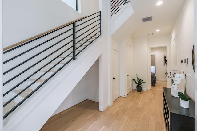 staircase featuring hardwood / wood-style flooring