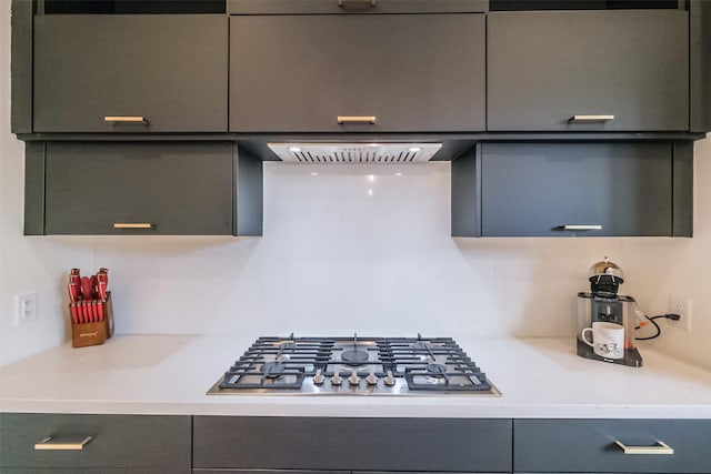 kitchen featuring stainless steel gas cooktop and exhaust hood