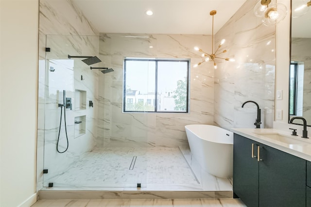 bathroom featuring vanity, plus walk in shower, and a notable chandelier