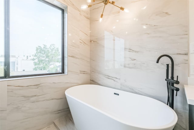 bathroom with a tub to relax in