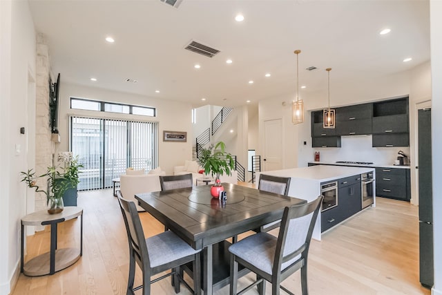 dining space featuring light hardwood / wood-style flooring