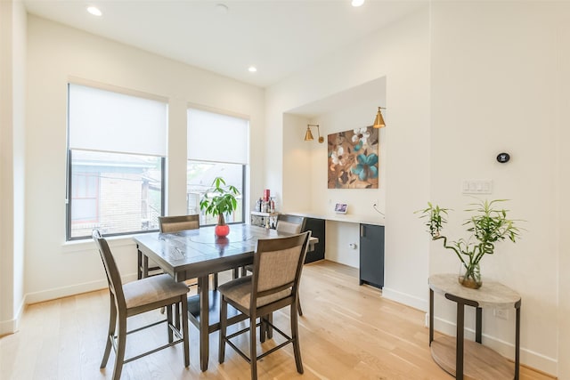 dining area with light hardwood / wood-style flooring