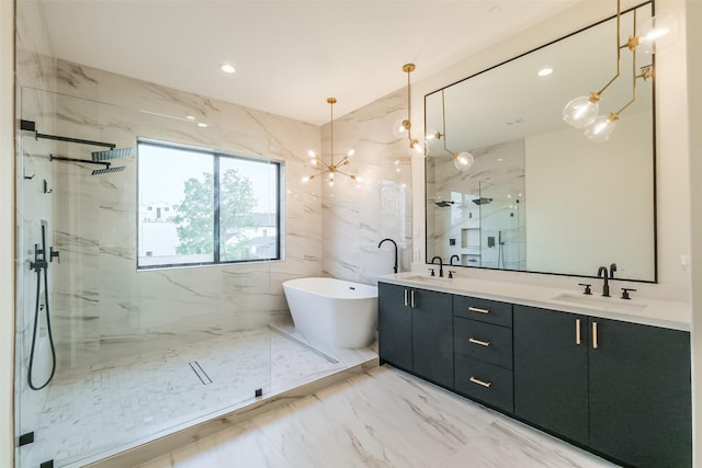 bathroom featuring a chandelier, vanity, and independent shower and bath