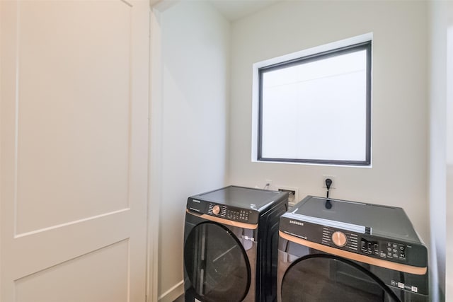 washroom with washer and dryer