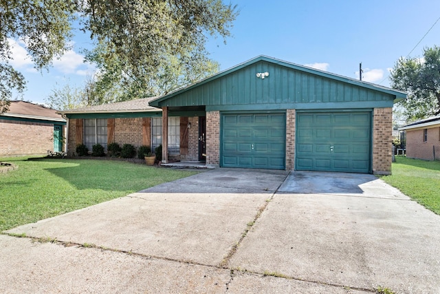 ranch-style house featuring a front yard and a garage