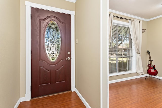 interior space with wood-type flooring and ornamental molding