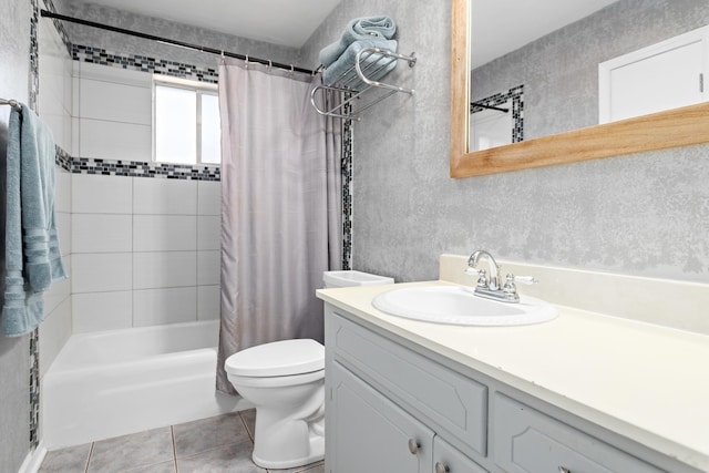 full bathroom featuring tile patterned flooring, shower / bath combo, vanity, and toilet