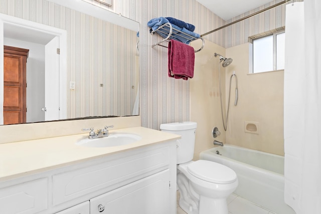 full bathroom featuring tile patterned floors, vanity, toilet, and washtub / shower combination