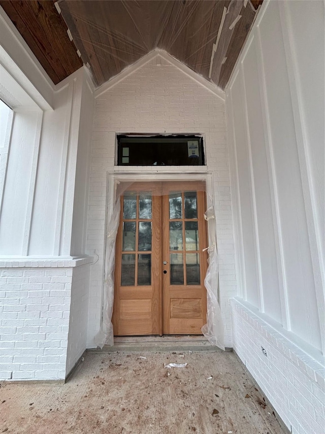 view of exterior entry featuring french doors