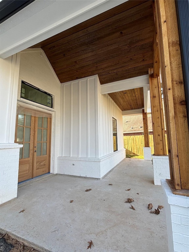 view of patio / terrace featuring a porch and french doors