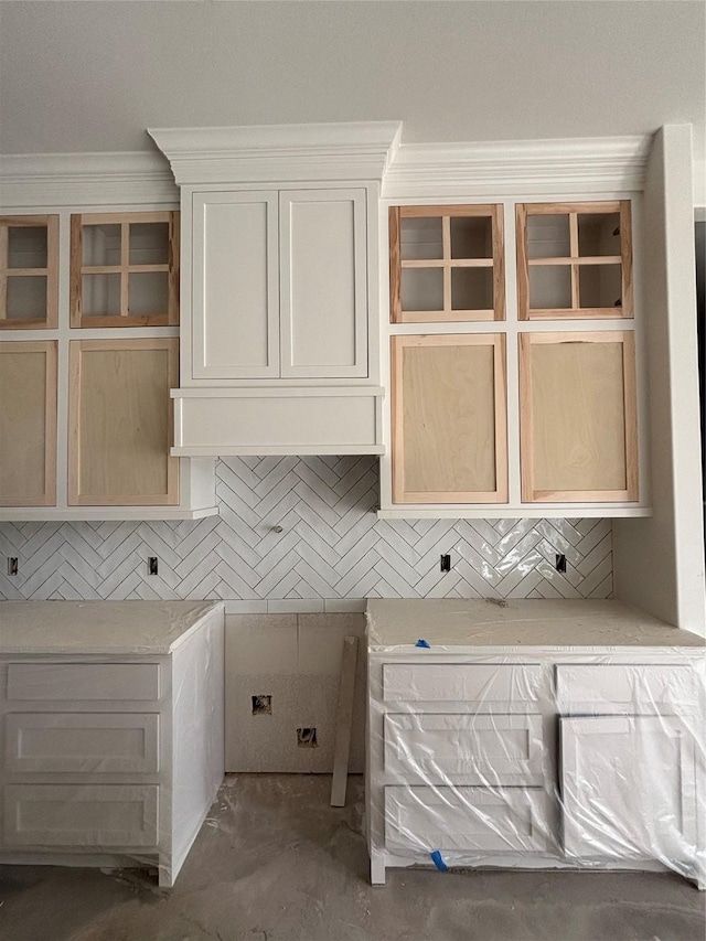 interior space featuring crown molding and concrete floors