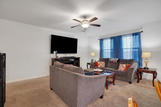 carpeted living room featuring ceiling fan