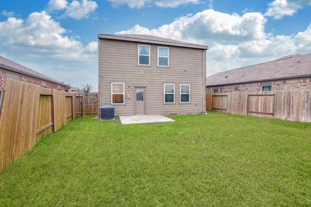 rear view of property with central AC, a yard, and a patio