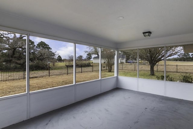 unfurnished sunroom featuring a rural view