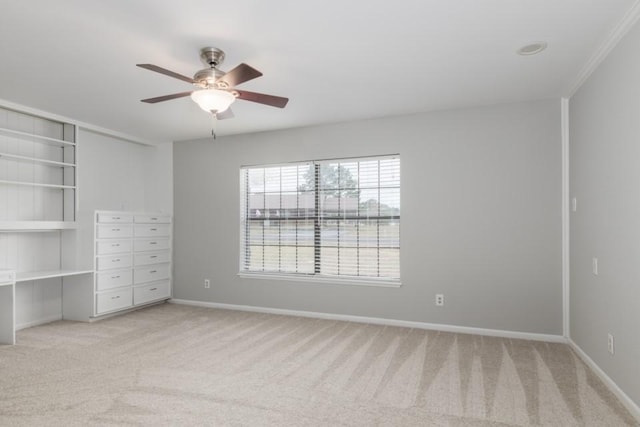 unfurnished bedroom with ceiling fan and light colored carpet