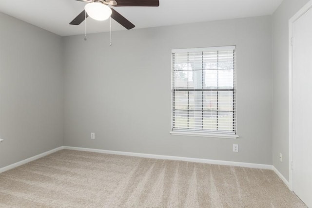 carpeted empty room with ceiling fan