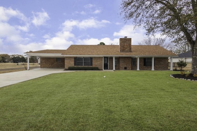 single story home with a front yard and a carport