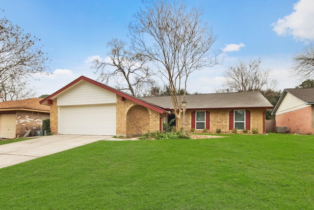 ranch-style home featuring central AC, a garage, and a front yard