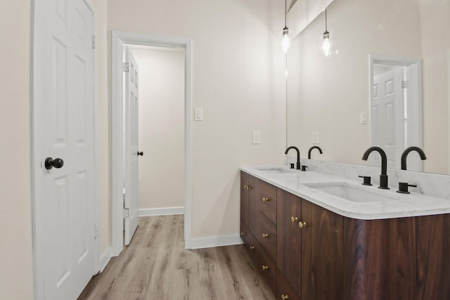 bathroom featuring vanity and hardwood / wood-style floors