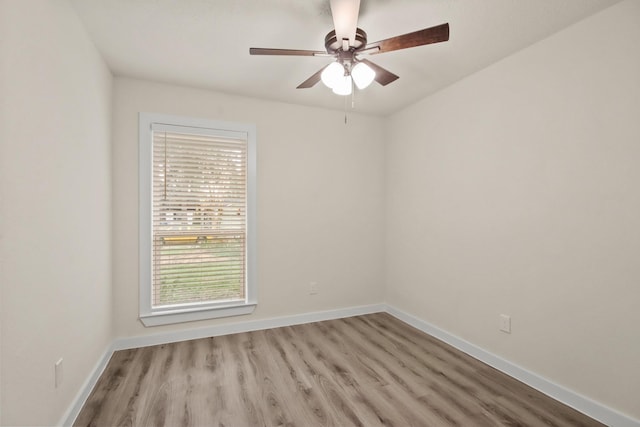 spare room featuring light hardwood / wood-style floors