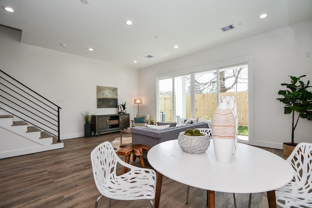 dining space featuring dark hardwood / wood-style floors