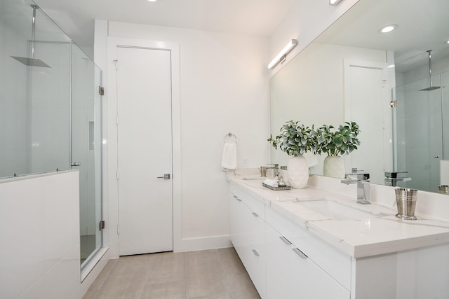 bathroom with tile patterned flooring, vanity, and an enclosed shower