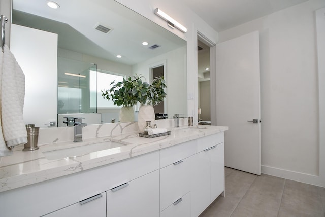 bathroom featuring vanity, a shower with shower door, and lofted ceiling