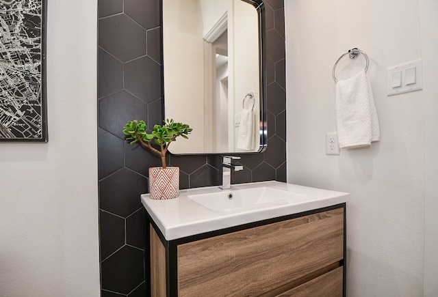 bathroom with vanity and backsplash