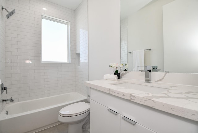 full bathroom featuring tile patterned floors, vanity, tiled shower / bath combo, and toilet