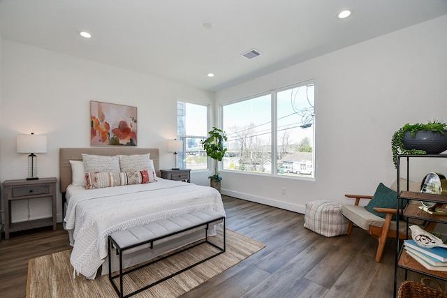 bedroom featuring dark hardwood / wood-style flooring