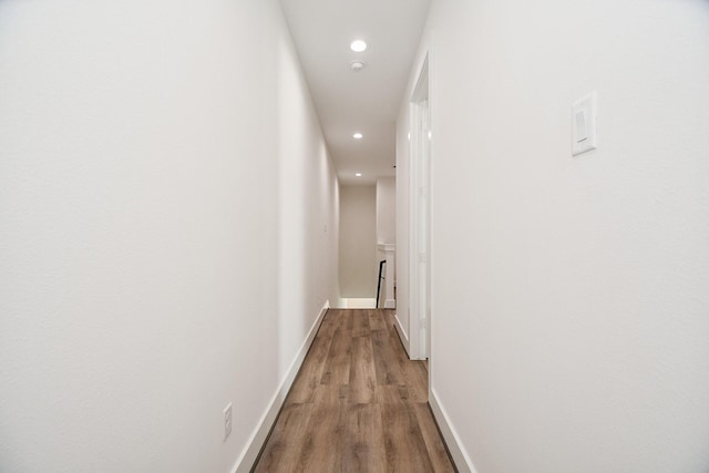 hall with hardwood / wood-style floors