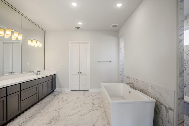 bathroom featuring vanity and a bathing tub