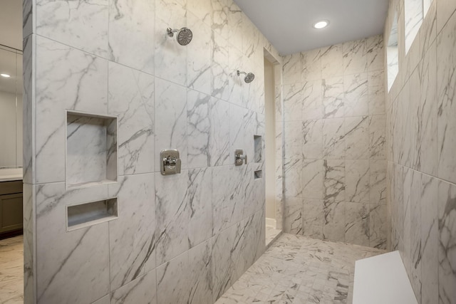 bathroom featuring a tile shower