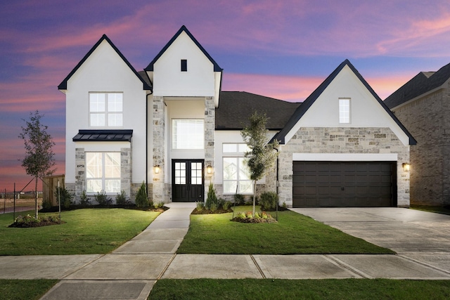 view of front facade featuring a yard and french doors