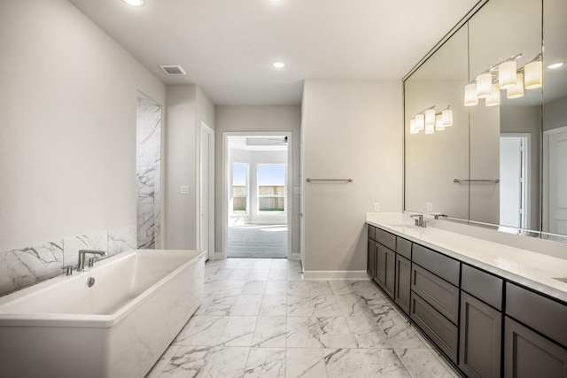 bathroom with a bathtub and vanity