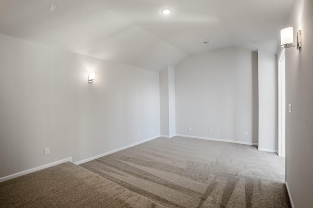 additional living space featuring carpet floors and lofted ceiling