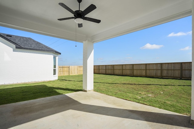 view of yard with a patio area and ceiling fan