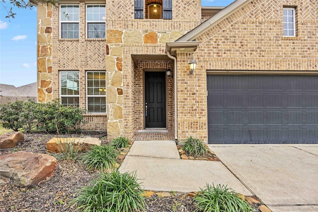 view of exterior entry with a garage