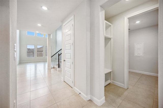 hallway with light tile patterned floors