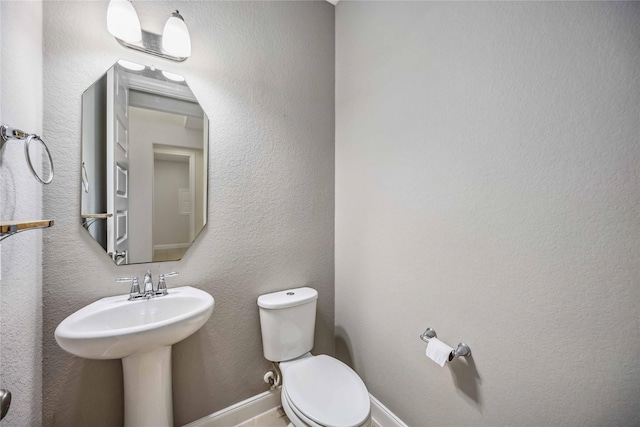 bathroom featuring toilet