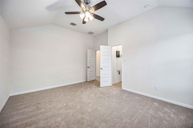 unfurnished bedroom featuring ceiling fan, light colored carpet, and lofted ceiling