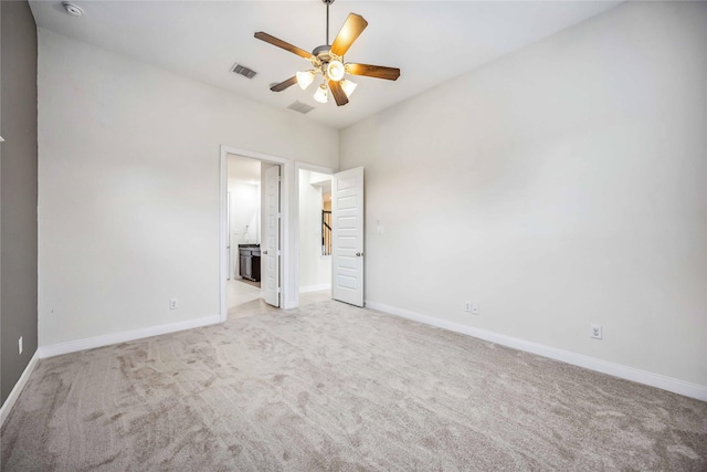 unfurnished bedroom featuring ceiling fan and light carpet