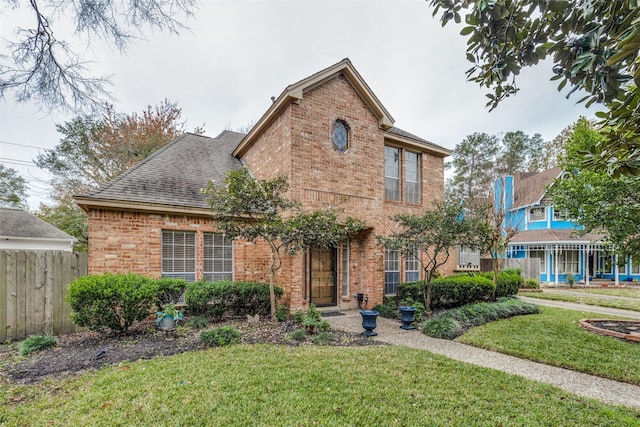 view of property featuring a front lawn