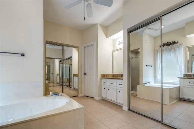 bathroom with shower with separate bathtub, vanity, tile patterned floors, and ceiling fan