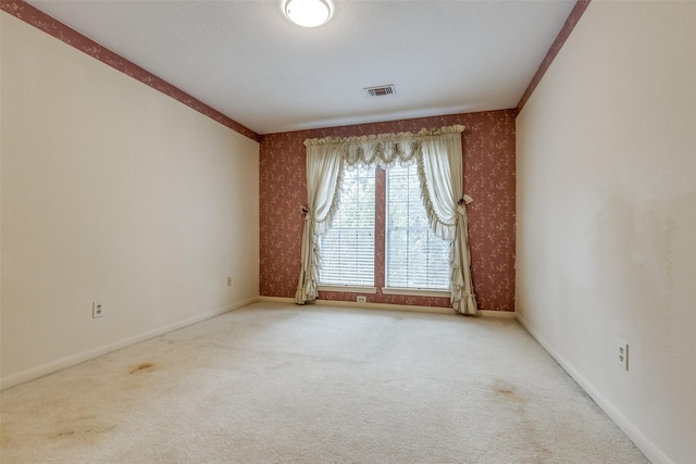 empty room with carpet flooring