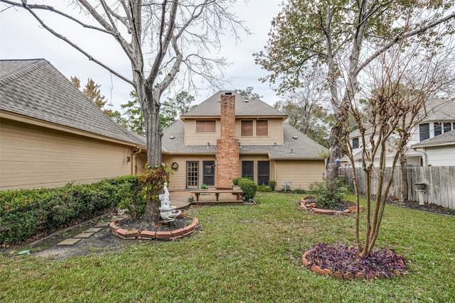 12135 Oakcroft Dr, Houston, TX 77070 - back of property with a lawn, fence, a chimney, and a patio