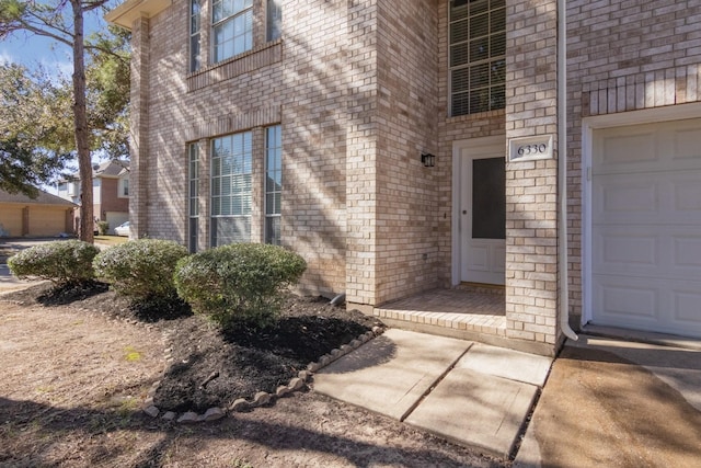 entrance to property featuring a garage